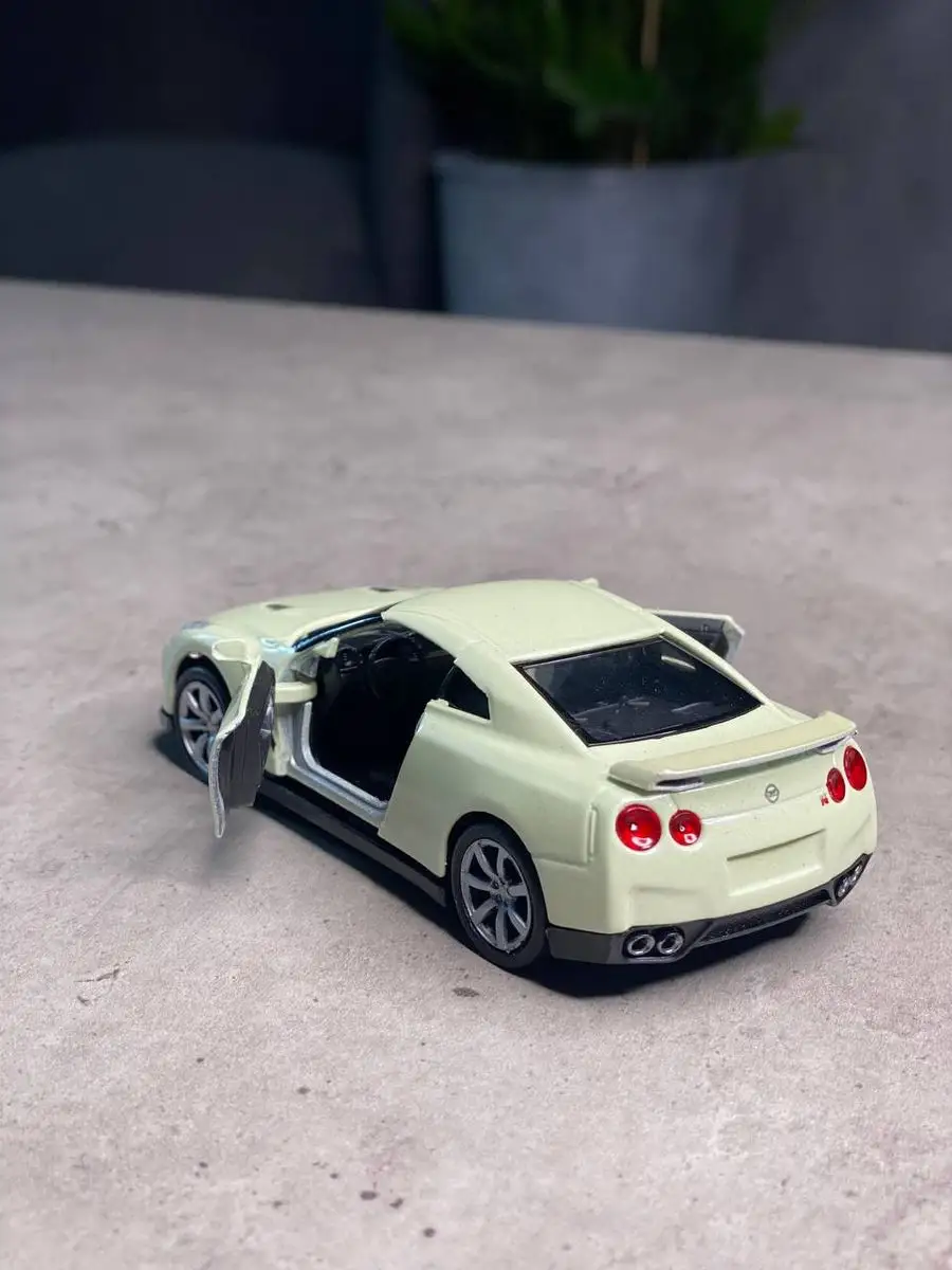 Металлическая машинка NISSAN GTR Ниссан ГТР Welly 165551577 купить за 506 ₽  в интернет-магазине Wildberries